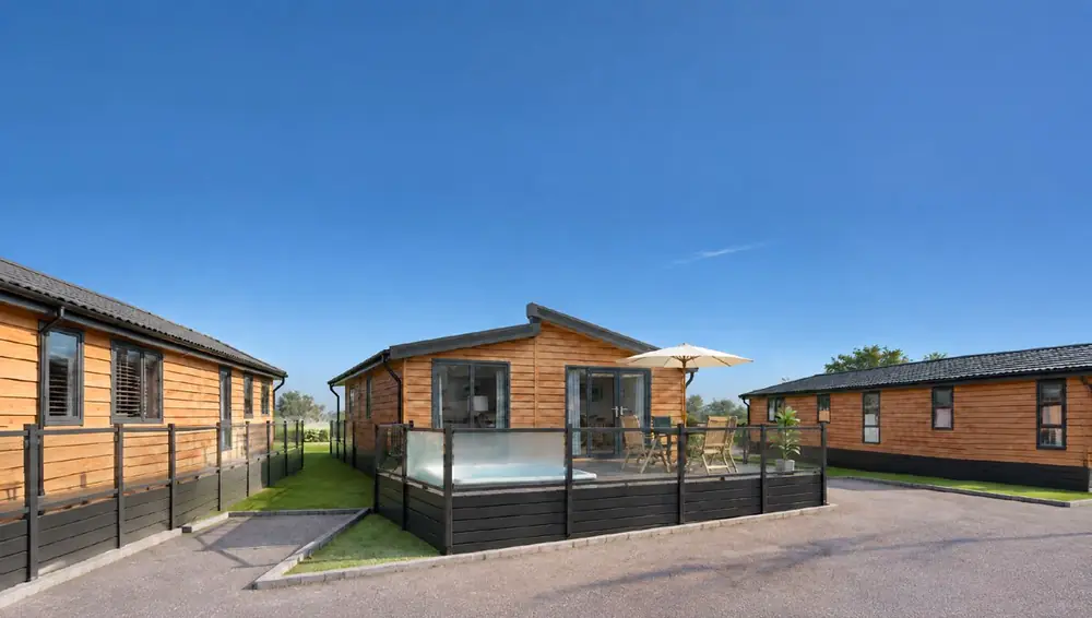 Lodge terrace with hot tub and parasol